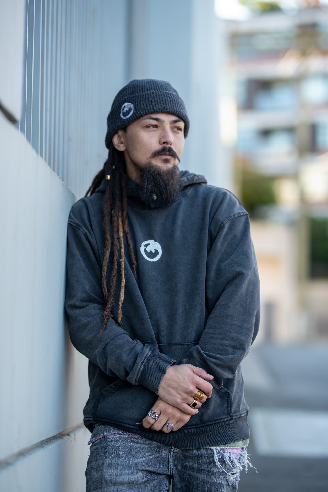 Matt in a Koifish Prophet hoodie on a city street