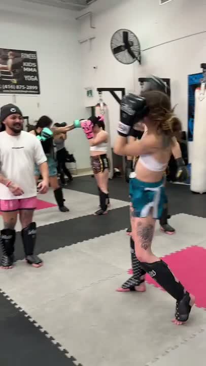 Matt coaching a group seminar on the gym mats