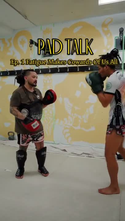 Matt holding pads for a fighter during Pad Talk episode one